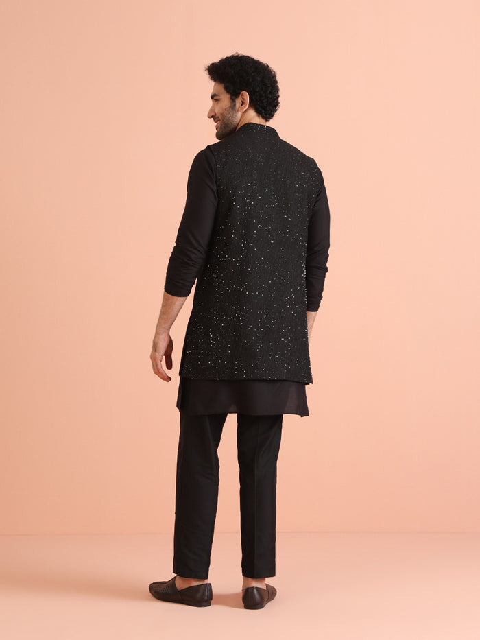 The back view of the model highlights Kisah's Black Silk Blend Sequined Nehru Jacket Set with clean finish