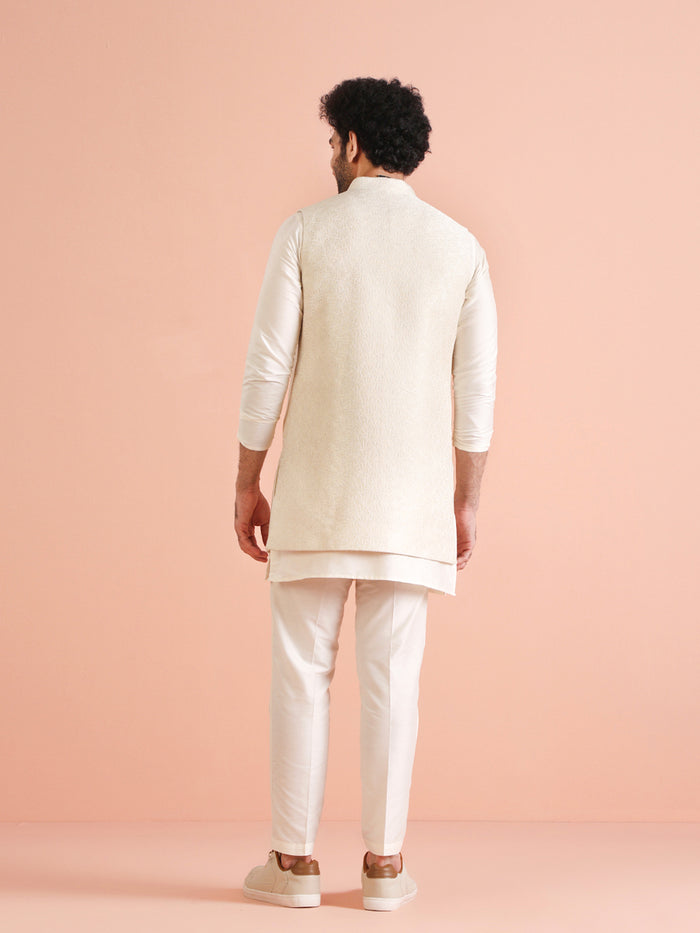 The model is standing, flaunting Kisah's Cream Silk Blend Embroidered Jacket Set for men without the jacket