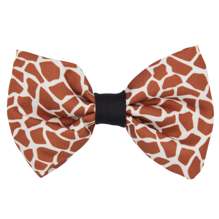 The Sassy Woof Dog Bowtie – Giraffic Park features a brown and white giraffe print with a black center band, shown on a white background. Pair it with the matching leash or adjustable harness for a coordinated look.
