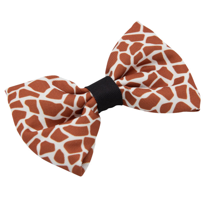 The Sassy Woof Dog Bowtie - Giraffic Park features a brown and white giraffe print with a black center knot, set against a white background—ideal to pair with the matching leash for a coordinated look.