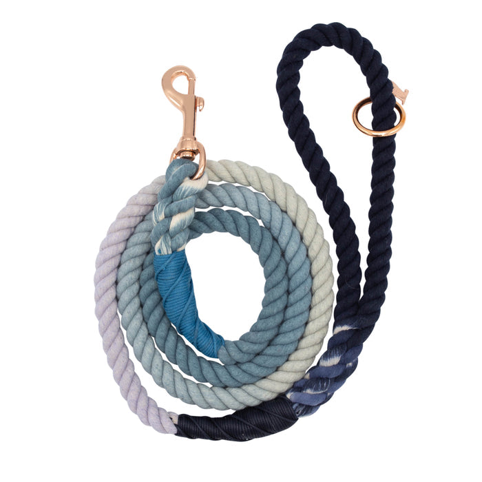 The Sassy Woof Dog Rope Leash - Oasis is a hand-crafted cotton leash with a beautiful ombre gradient from light lavender to dark navy, finished with a sturdy brass clasp.