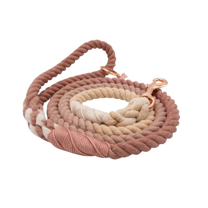 The Sassy Woof Dog Rope Leash - Pearly is a hand-crafted ombre leash in pink, beige, and cream with a rose gold clip and decorative wrap on one end, shown against a plain white background.