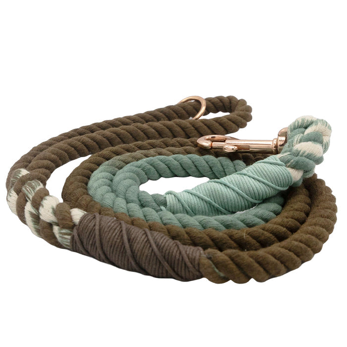 The Sassy Woof Dog Rope Leash - Tail Mix is a durable leash in brown, mint green, and cream with a metal clasp, shown coiled neatly on a white background.