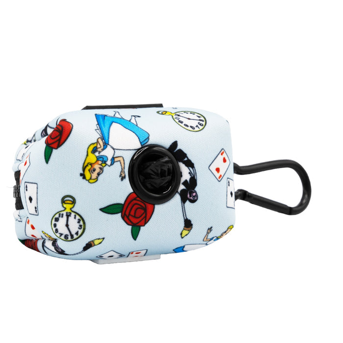 The Sassy Woof Dog Waste Bag Holder - Alice in Wonderland (Blue) is a light blue pouch with whimsical designs and a black dispenser, perfect for stylish dog walks.