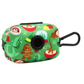 The Sassy Woof Dog Waste Bag Holder - Elf™ is a green neoprene holder with holiday-themed designs like gingerbread cookies and ornaments. It features a black plastic clip for easy attachment to your leash or bag.